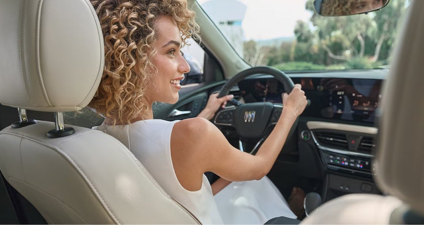 Lady at the driver seat of a Buick