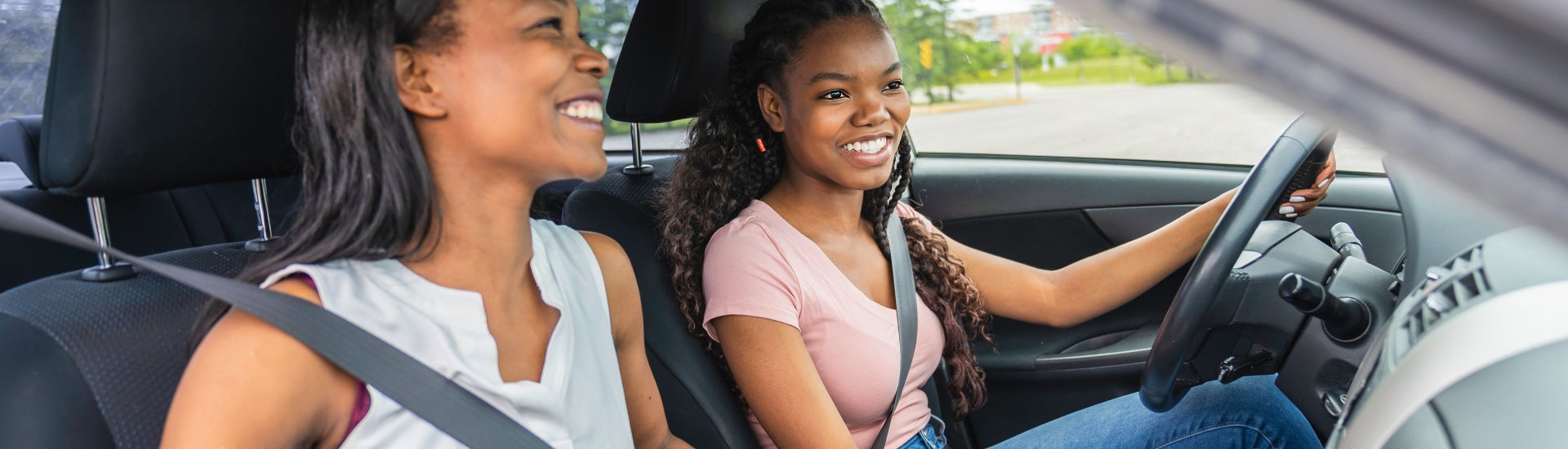 Mother & Daughter Driving off in new car